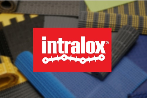 The Intralox logo over samples of modular plastic conveyor belting