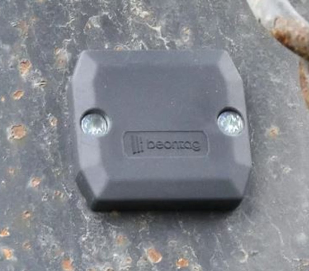 A rugged battery-powered active RFID tag mounted on a hard surface