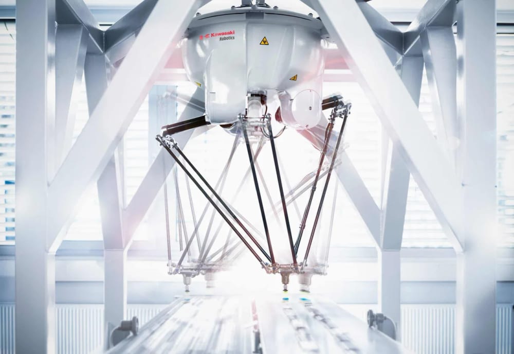 A Kawasaki YF Series delta robot picking product from a conveyor